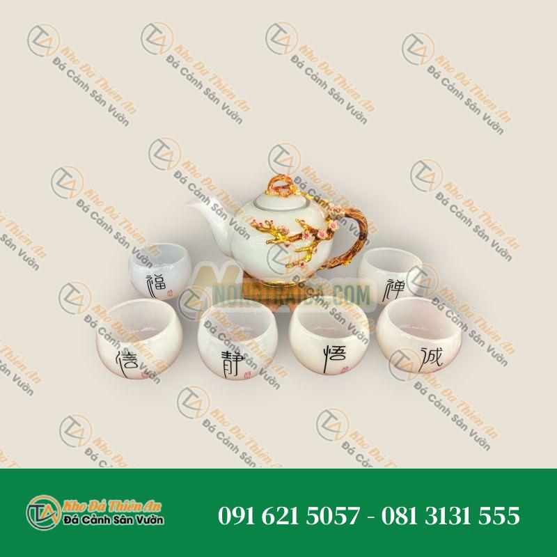 Bộ ấm trà chạm hoa mai với ly chạm chữ đá bạch ngọc