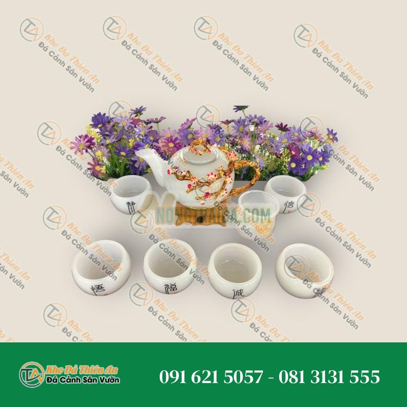 Bộ ấm trà chạm hoa mai với ly chạm chữ đá bạch ngọc