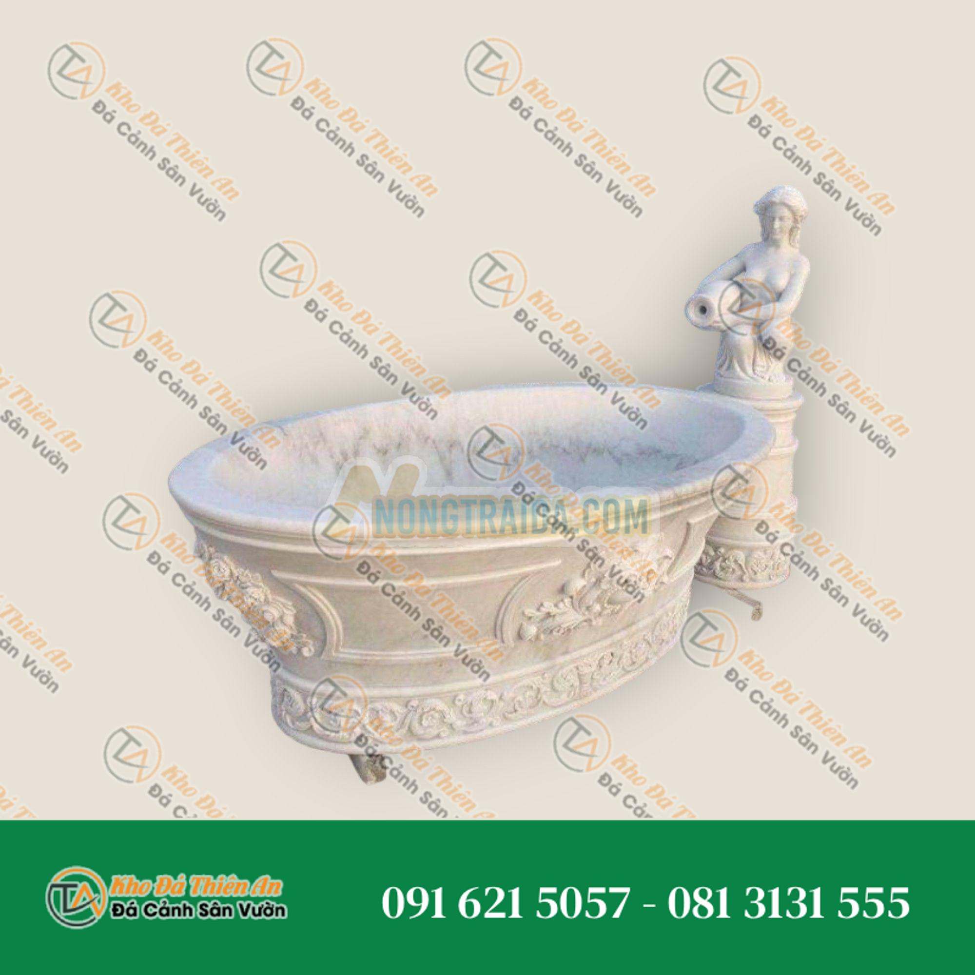 Bồn tắm trắng Carrara với những đường vân xám nhỏ, kiểu dáng thác nước sang trọng, có hình điêu khắc tượng phụ nữ trần trụi